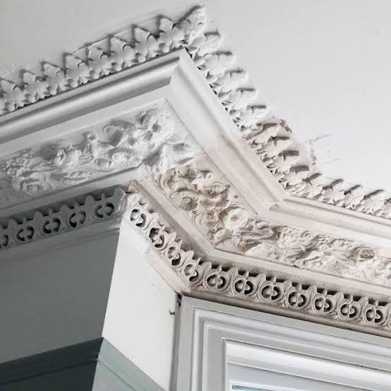 Deeply enriched cornice with egg-and-dart detailing